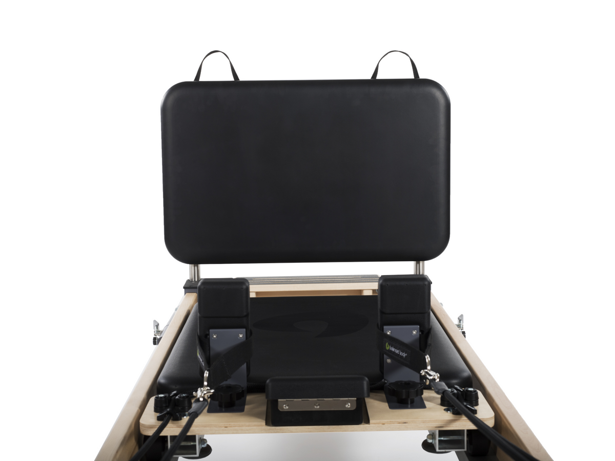 Balanced Body Black Padded Jumpboard, mounted on a Rialto Reformer, for Jumps and cardio exercises