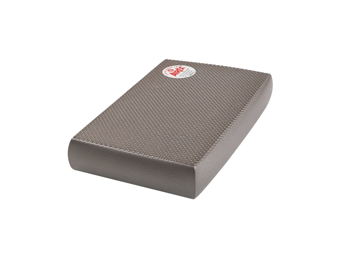 Airex Balance-pad Mini lava, Gesamtansicht mit genoppter Oberfläche, für Gleichgewichtstraining und Koordination